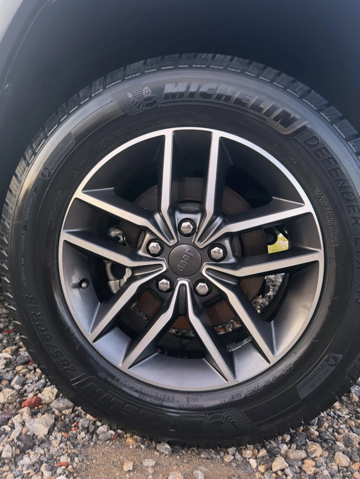 Jeep alloy wheel and Michelin Defender tire cleaned and dressed