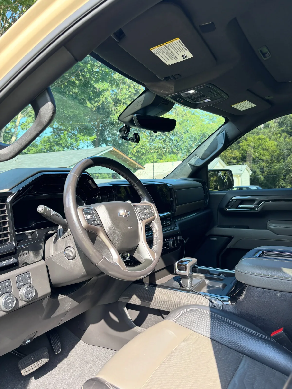Cleaned Chevrolet Silverado front cabin with conditioned leather steering wheel and console